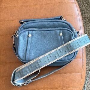 Elegant Blue Crossbody Bag with Patterned Strap